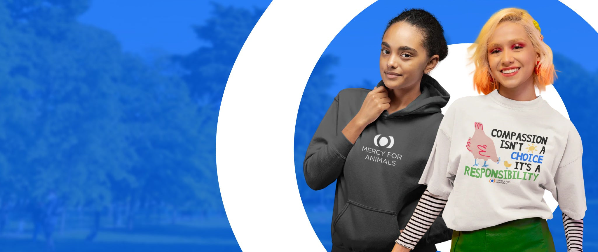 Two people standing side by side against a blue graphic background. The person on the left wears a dark gray hoodie with a white circular logo and the words 'MERCY FOR ANIMALS'.